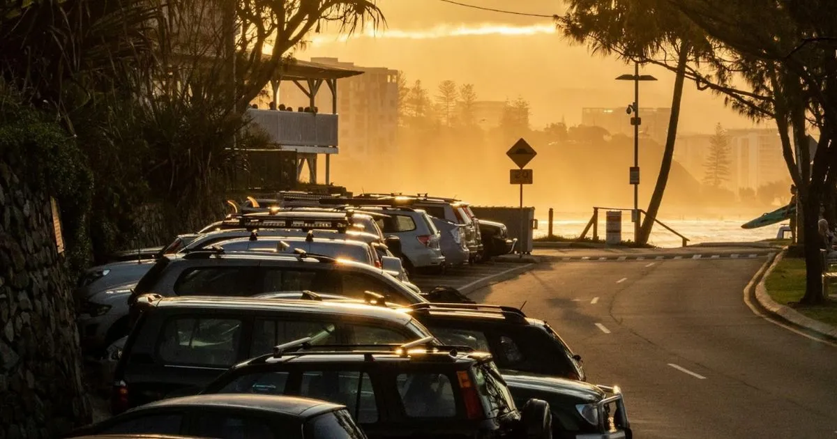 Irregular parking of cars on the bank of a road