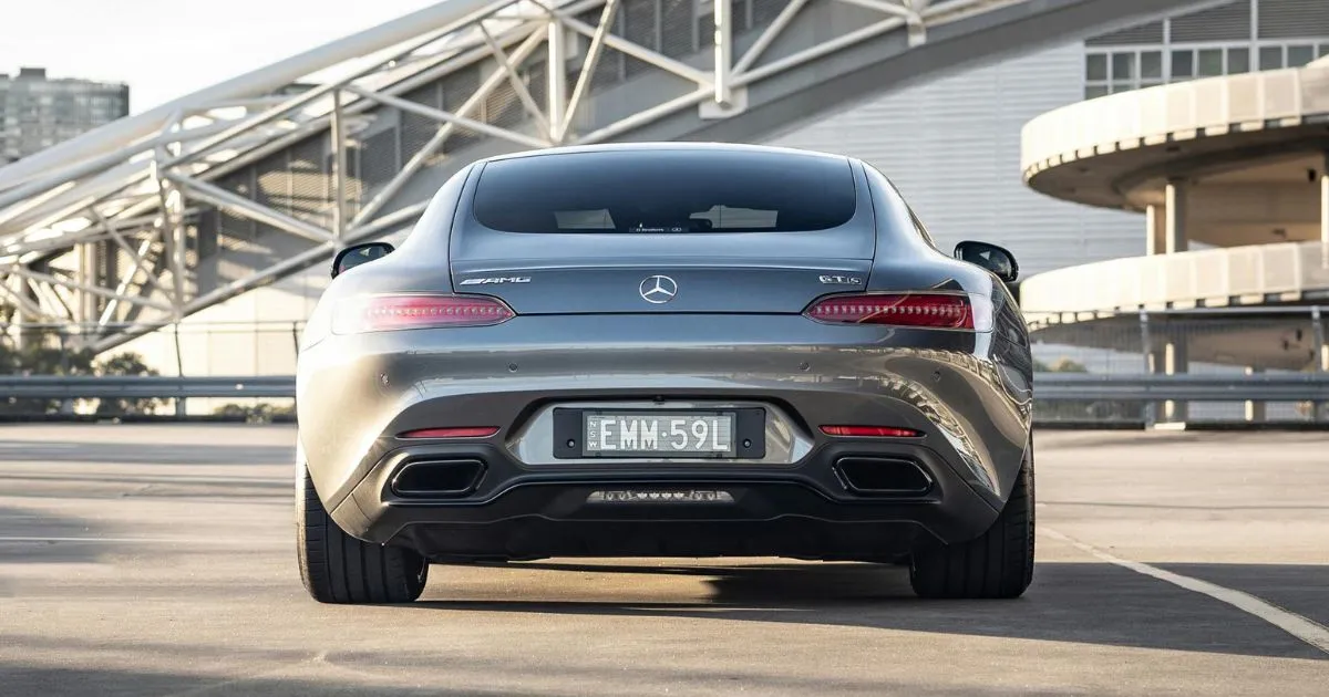 A Beautiful Car Parked In An Open Uncovered Parking Space