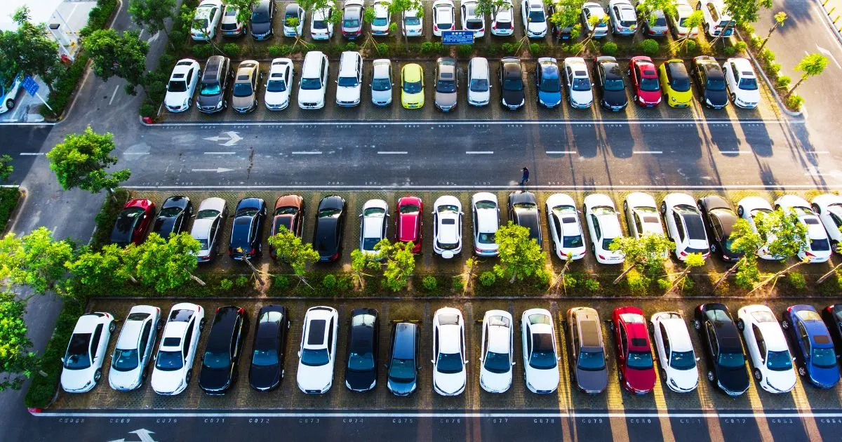 A Beautiful Parking Lot In Auckland With Multiple Parked Vehicles