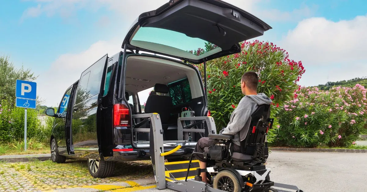 A Black Car Parked In A Disability Parking Space With The Owner About To Enter His Vehicle A Black Car Parked In A Disability Parking Space With The Owner About To Enter His Vehicle
