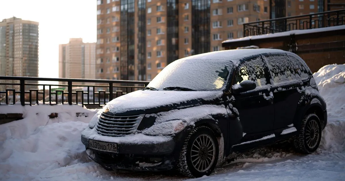 A Black Car Partially Covered In Snow As It Was Parked Outside A Black Car Partially Covered In Snow As It Was Parked Outside