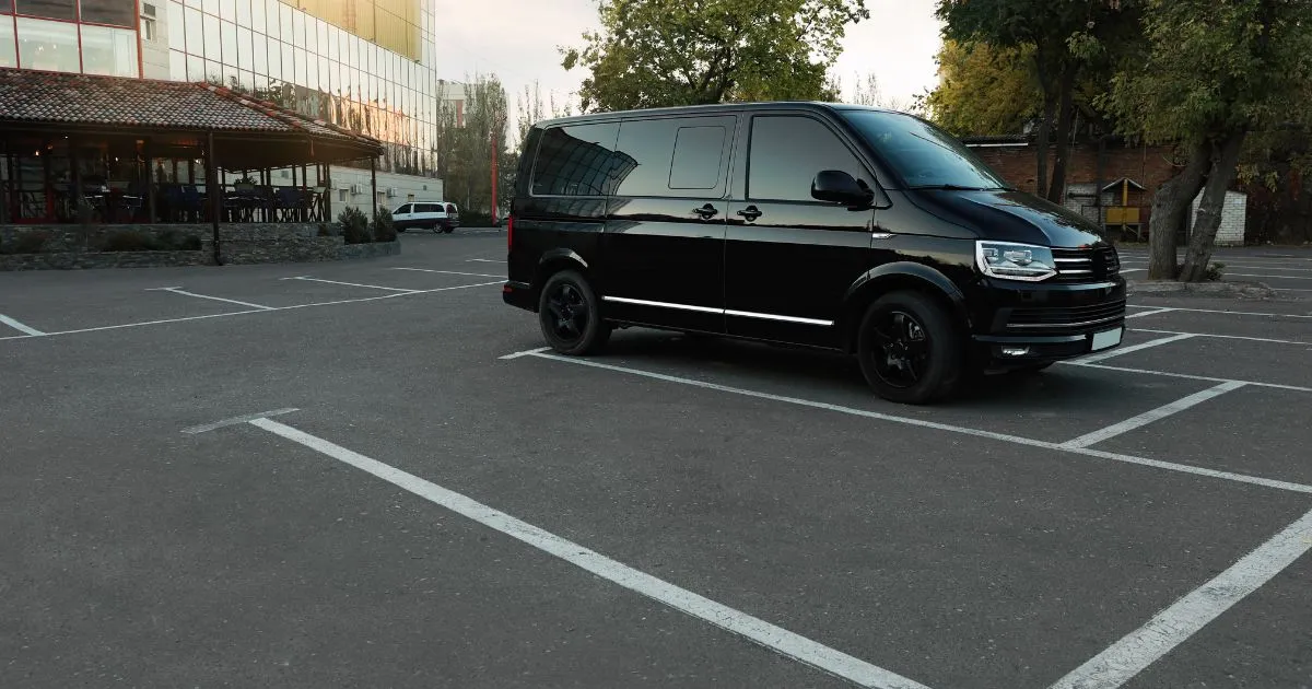 A Black Van Parked In A Legitimate Parking Space A Black Van Parked In A Legitimate Parking Space
