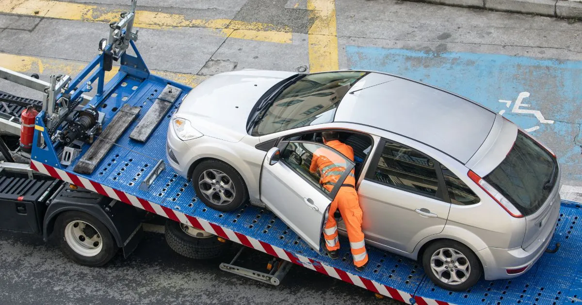 A Car Being Towed By A Truck A Car Being Towed By A Truck