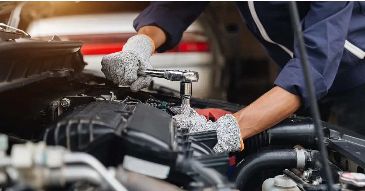 A Car Mechanic Working On Routine Vehicle Checkup