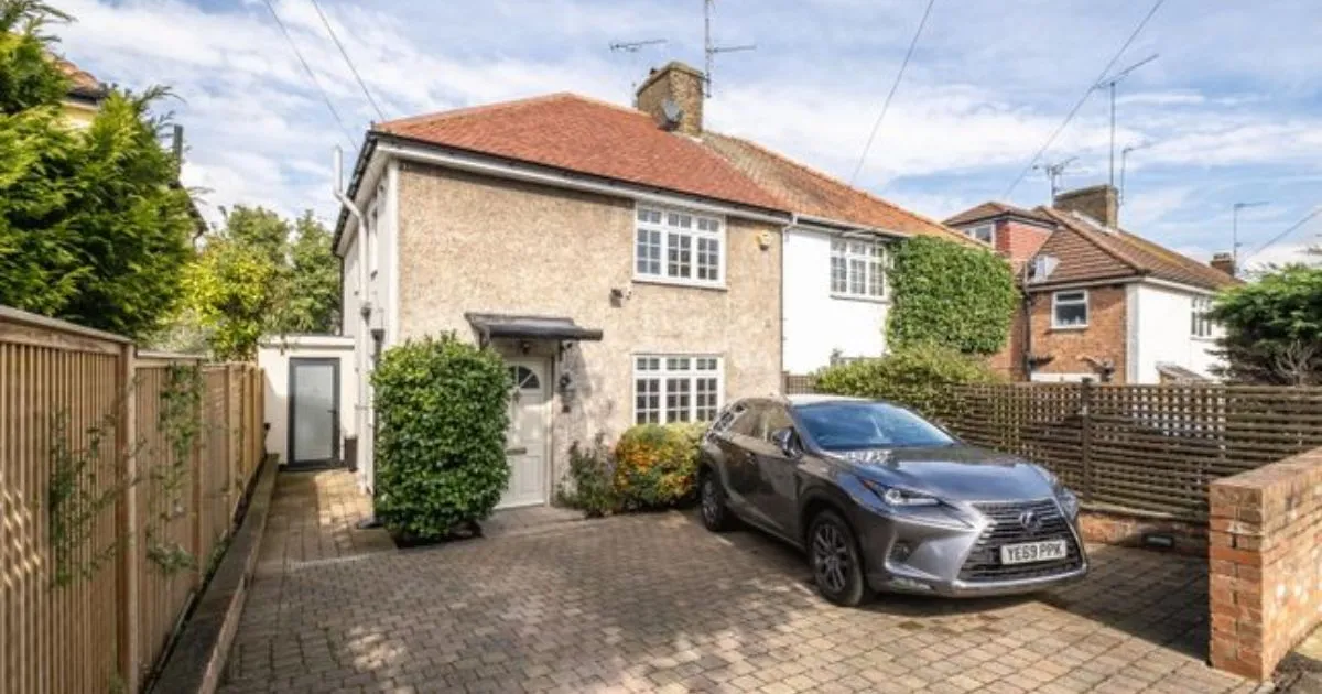 A Car Parked In A House With Space Available For Two More Vehicles