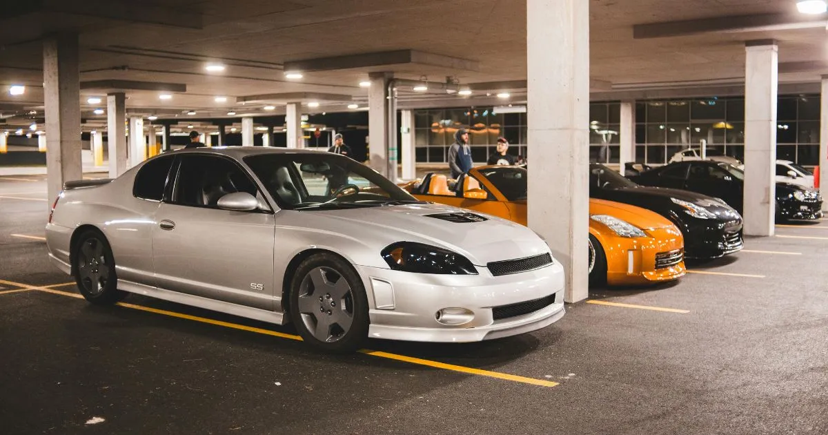 A Car Parking Garage With Some Parked Cars And Some Empty Spaces A Car Parking Garage With Some Parked Cars And Some Empty Spaces