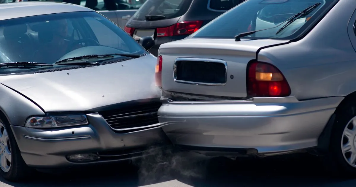 A Collision Between Two Cars In Parking Lot