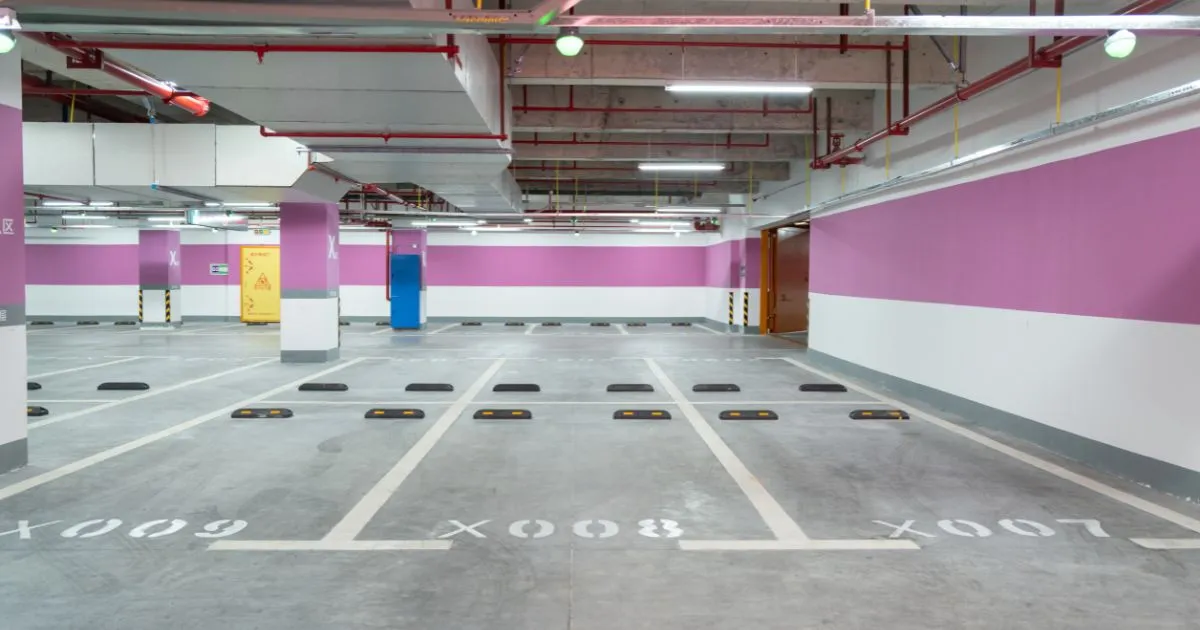 A Commercial Parking Garage With Numerous Available Parking Spaces