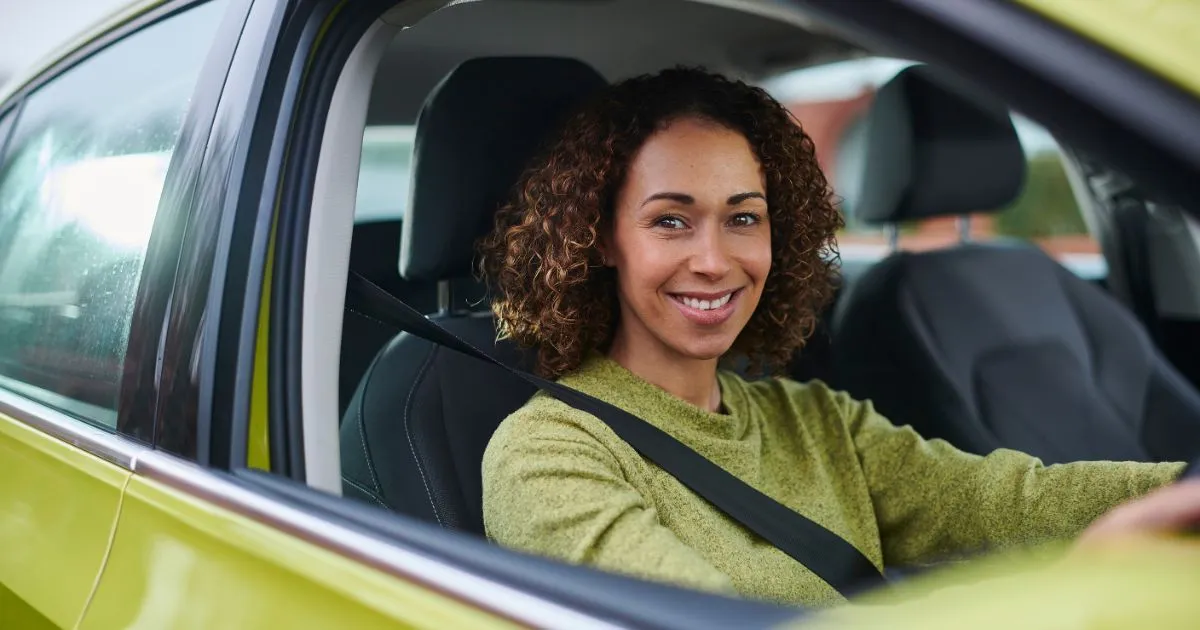 A Confident Female Suv Driver In A Parking Lot A Confident Female Suv Driver In A Parking Lot