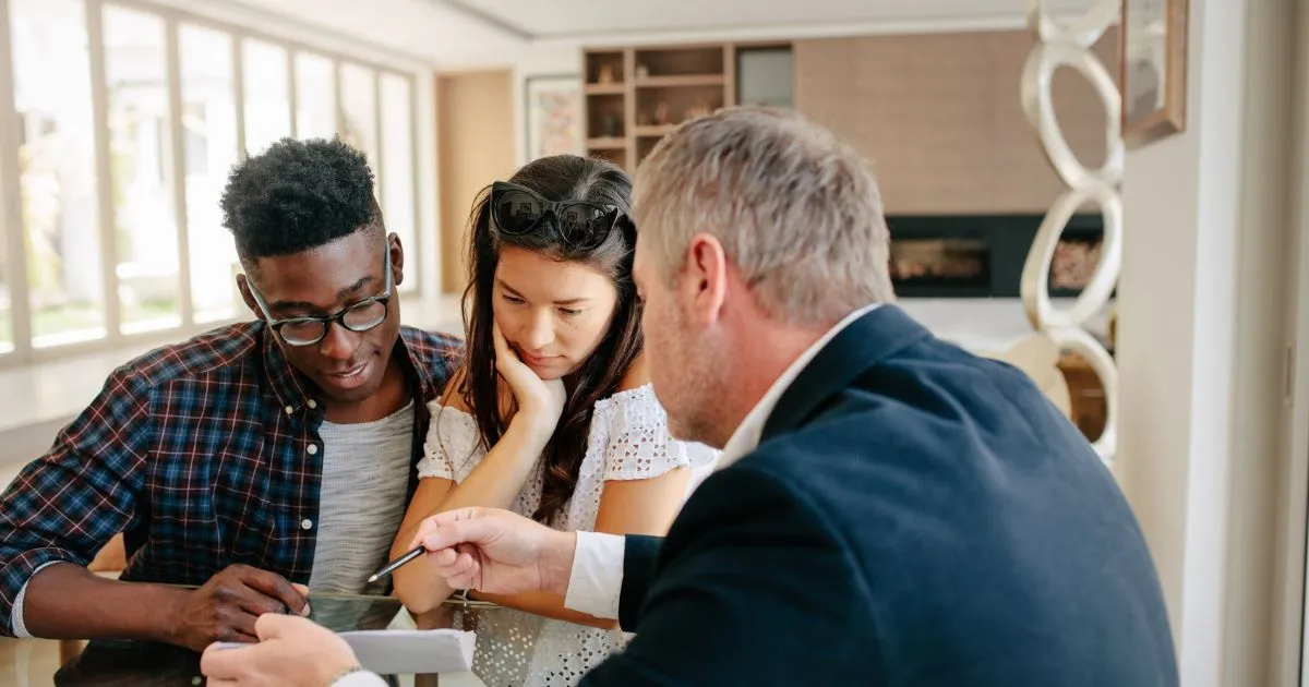 A Couple Taking Advice And Consultation From A Mortgage Broker