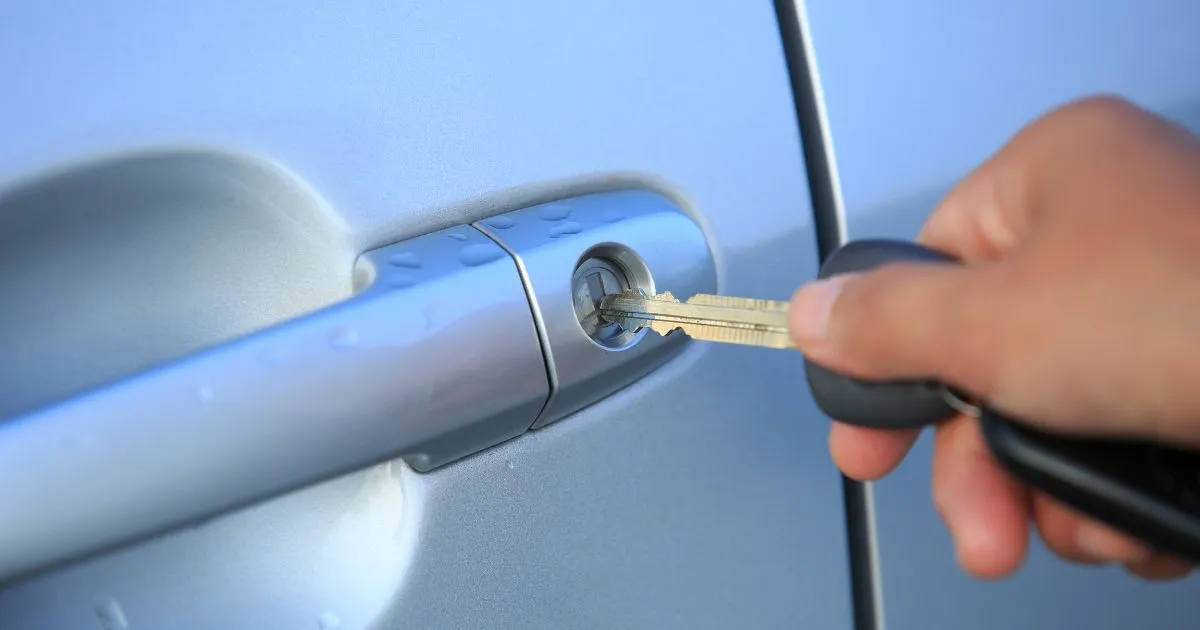 A Driver Locking His Vehicle After Parking It In An Overnight Parking Spot