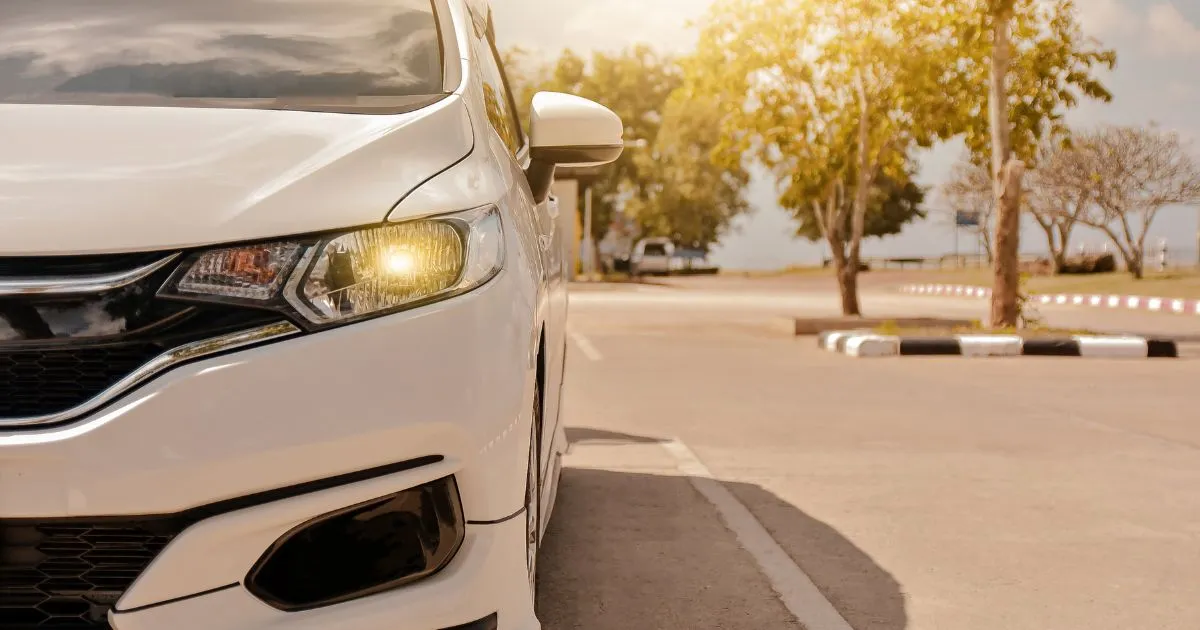 A Driver Parking His White Car On The Street A Driver Parking His White Car On The Street