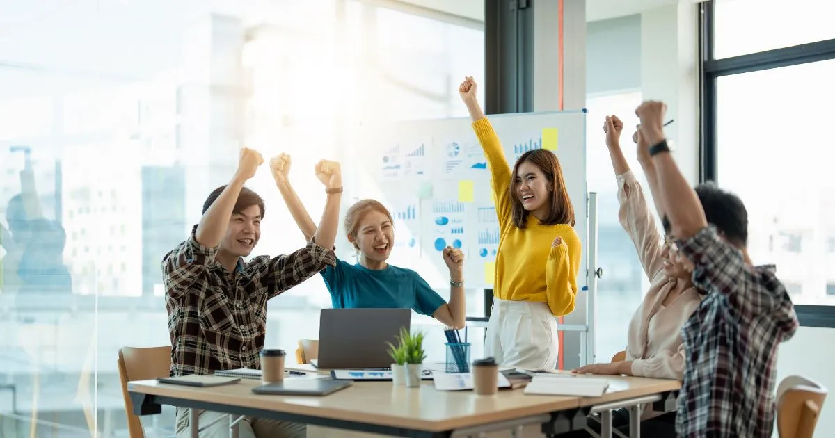 A Group Of People Celebrating Their Success