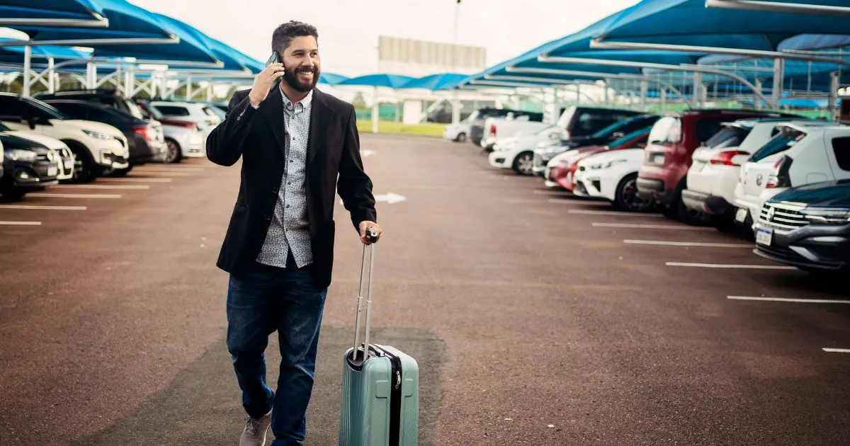 A Happy Customer Leaving A Parking Lot After Parking His Vehicle A Happy Customer Leaving A Parking Lot After Parking His Vehicle