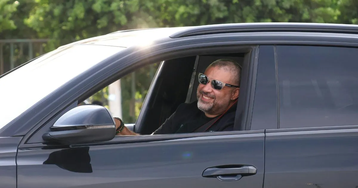 A Happy Driver Posing After Finding A Perfect Parking Spot For His Car A Happy Driver Posing After Finding A Perfect Parking Spot For His Car