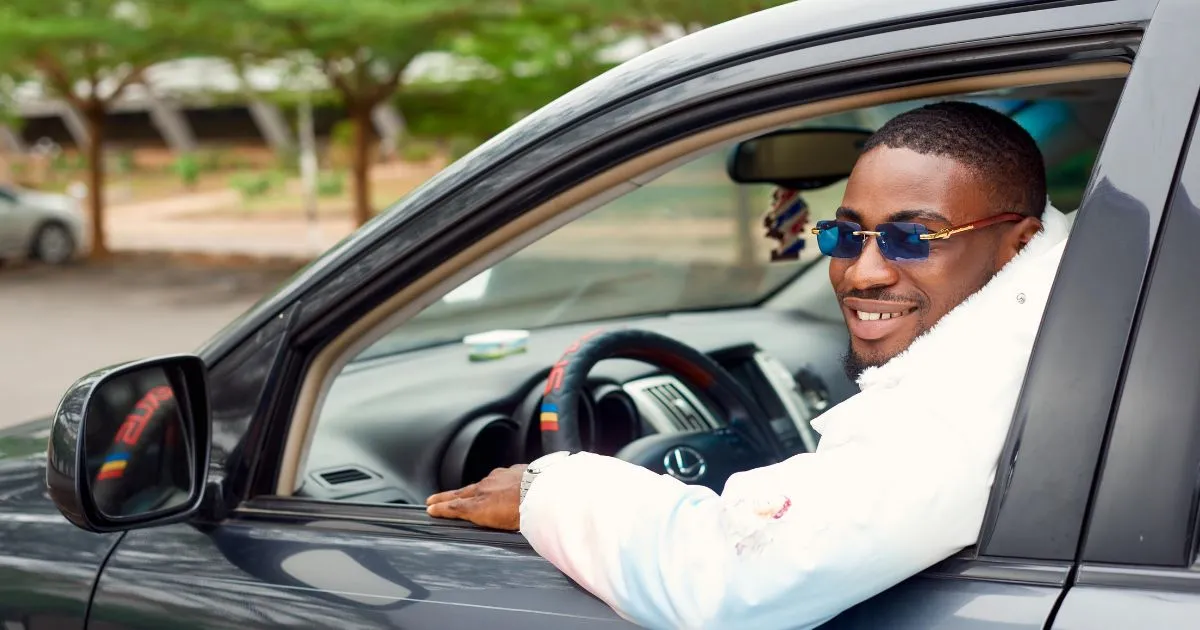A Happy Driver Taking His Car Out Of A Smart Parking Lot A Happy Driver Taking His Car Out Of A Smart Parking Lot