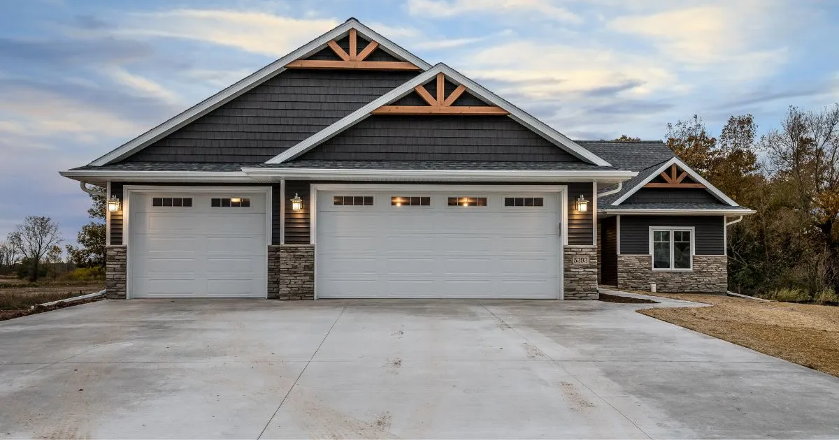 A House With A Large Driveway Ideal For Hosting Multiple Vehicles