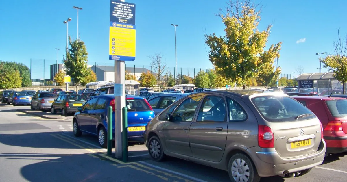 A Huge Parking Lot Of A Shopping Centre With Spaces For Parents With Prams