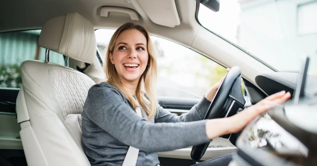 A Lady Driver Happy After Finding A Perfect Parking Spot For Her Car