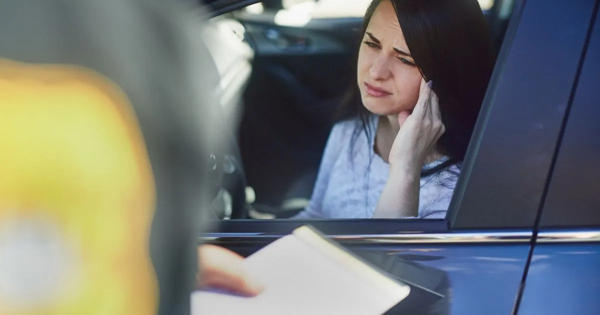 A Lady Driver Worried About A Potential Parking Fine