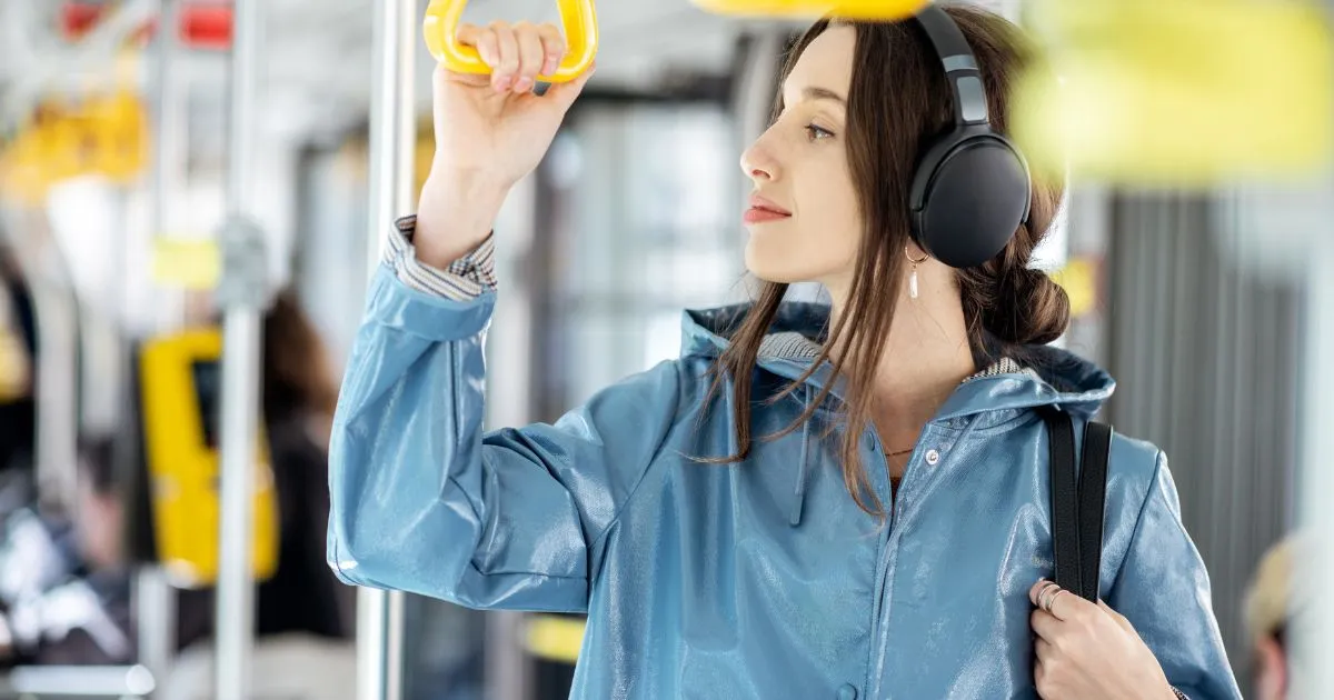 A Lady Enjoying Her Ride In A Public Transport Train