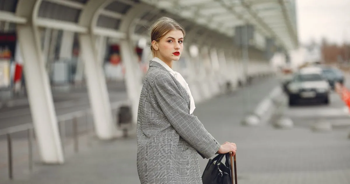 A Lady Posing With Her Suitcase After Parking Her Vehicle At An Airport Car Park A Lady Posing With Her Suitcase After Parking Her Vehicle At An Airport Car Park