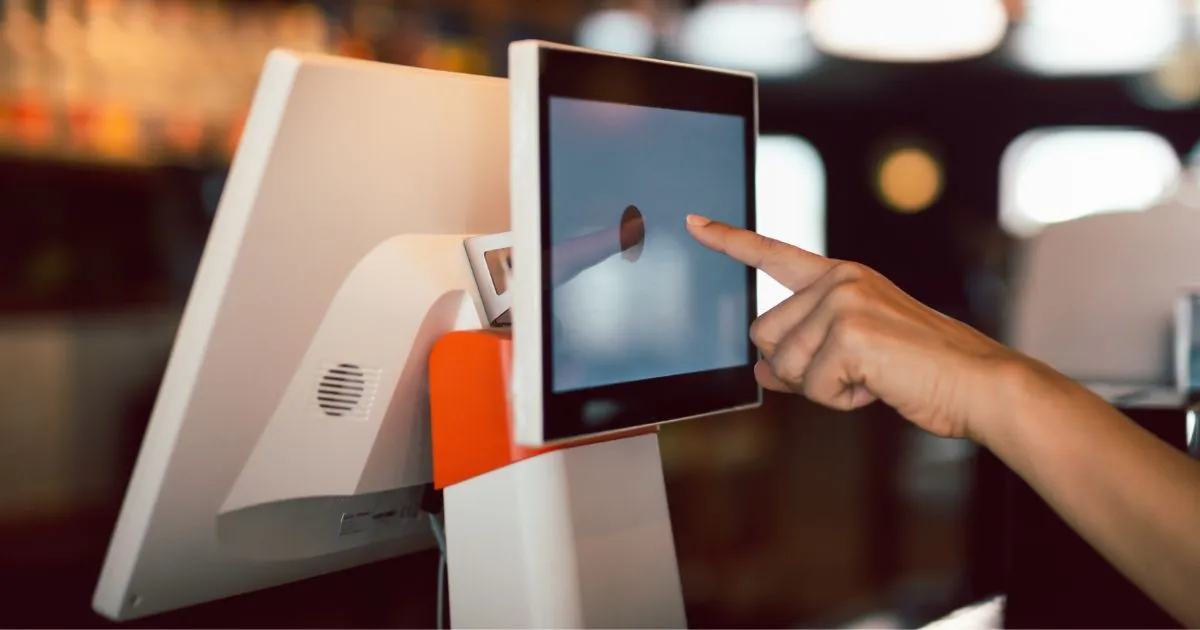 A Lady Using A Digital Payment System To Pay For Parking