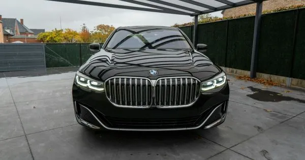 A Luxury Black Bmw Parked In A Rented Residential Parking Space A Luxury Black Bmw Parked In A Rented Residential Parking Space