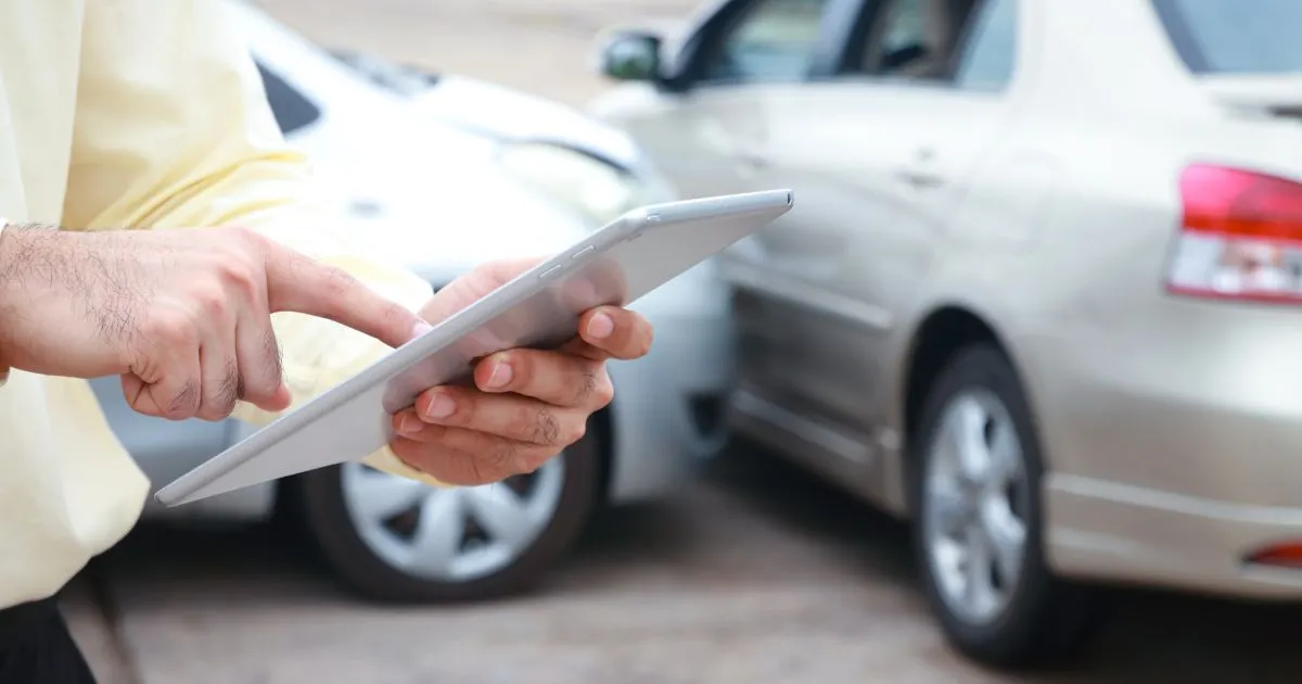 A Man Finding Parking Spaces In Melbourne On His Tablet