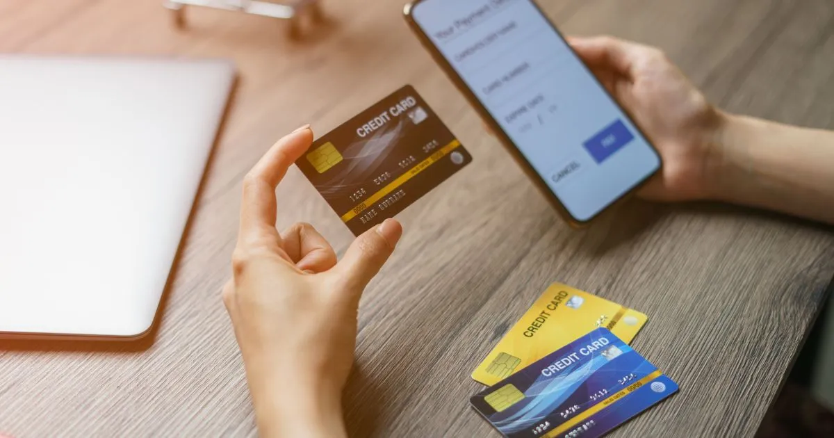 A Man Making An Online Payment Via His Credit Card For His Parking Deal A Man Making An Online Payment Via His Credit Card For His Parking Deal