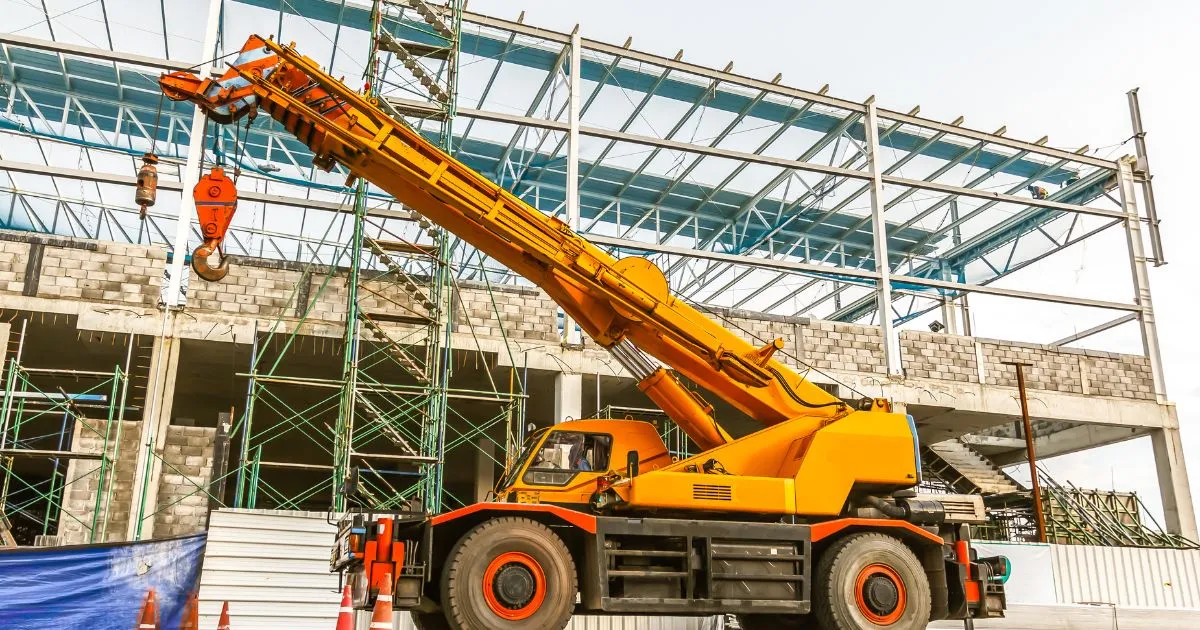 A Mobile Crane At A Construction Site A Mobile Crane At A Construction Site