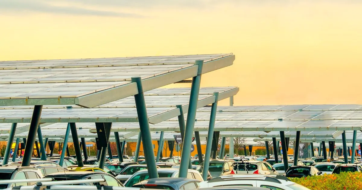 A Modern Innovative Parking Lot With Solar Panels And Multiple Parked Cars A Modern Innovative Parking Lot With Solar Panels And Multiple Parked Cars