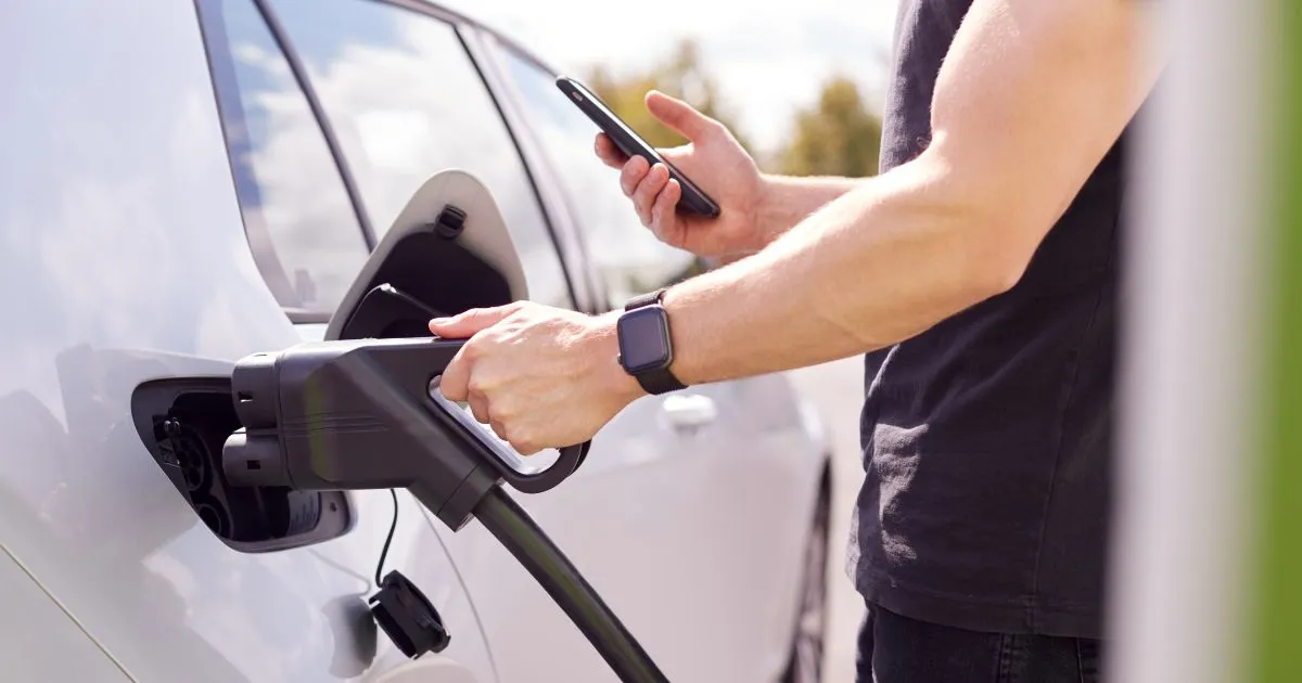 A Modern Parking Lot With Facilities Of Electric Vehicle Charging A Modern Parking Lot With Facilities Of Electric Vehicle Charging