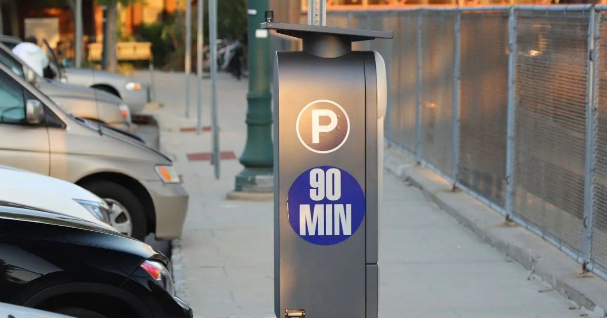 A Modern Parking Lot With Parked Cars And Payment Machine A Modern Parking Lot With Parked Cars And Payment Machine