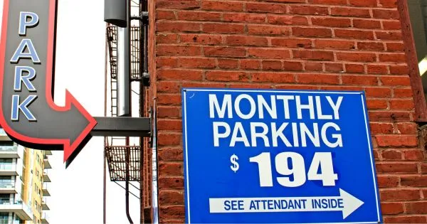 A Monthly Parking Ad Board On A Wall With Its Cost A Monthly Parking Ad Board On A Wall With Its Cost