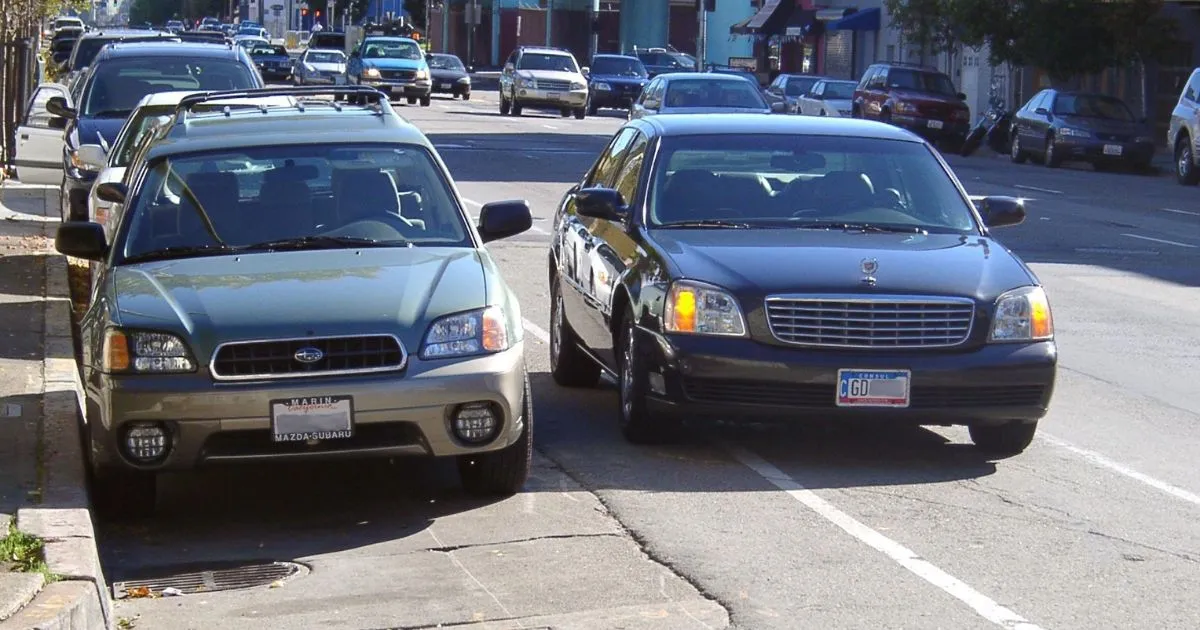 A Perfect Example Of Double Parking On The Main Street Of An Area