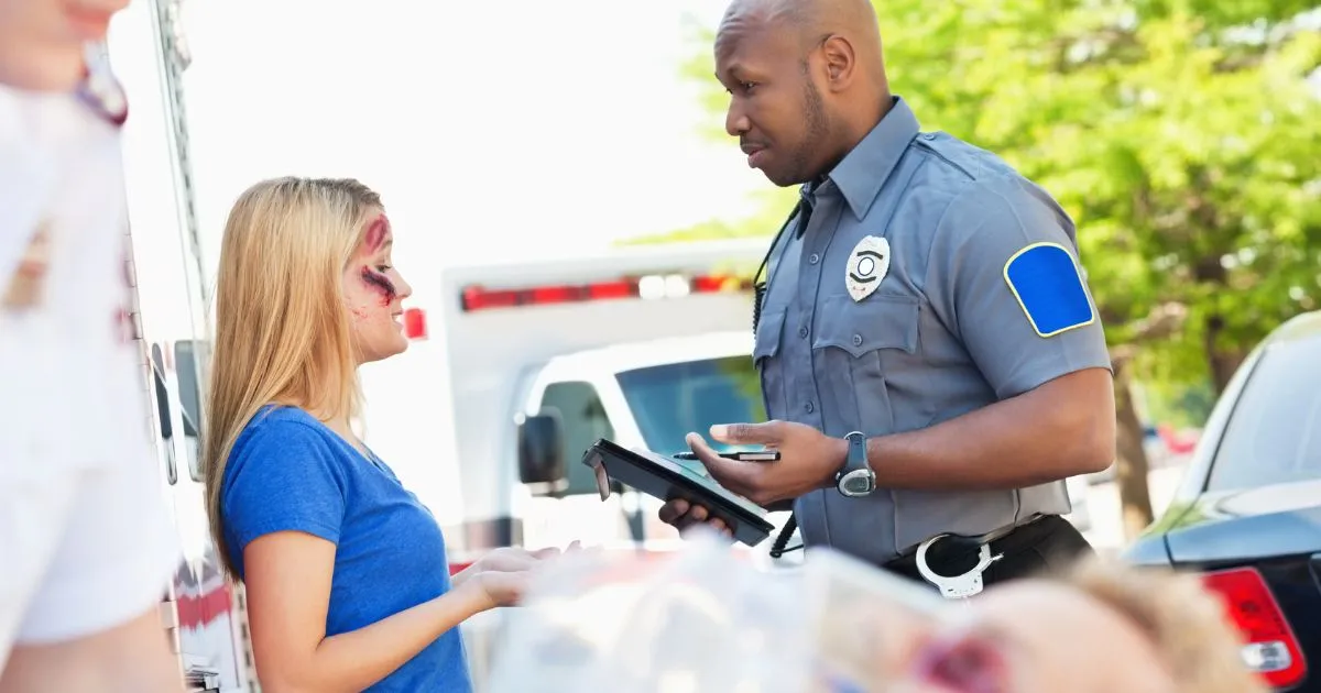 A Policeman Investigating An Injured Girl In A Parking Lot Accident Case