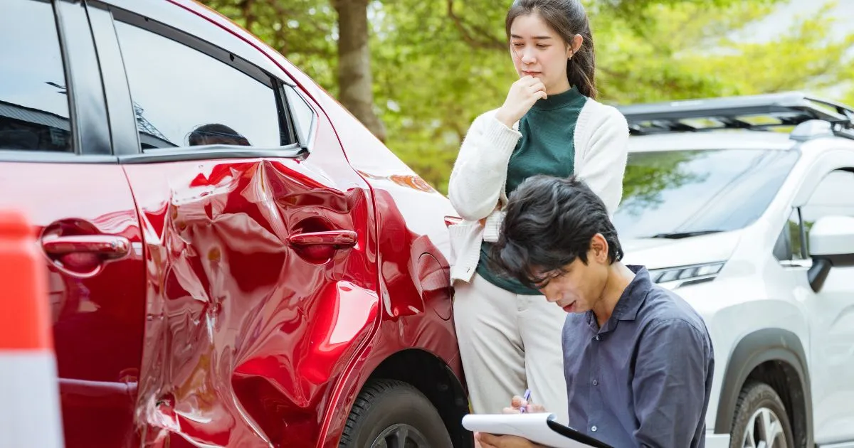 A Red Car After Being Hit By Another Vehicle