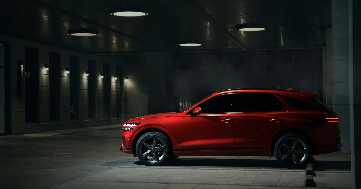 A Red Car Parked In A Parking Garage With Spaces Available For Many Other Vehicles A Red Car Parked In A Parking Garage With Spaces Available For Many Other Vehicles