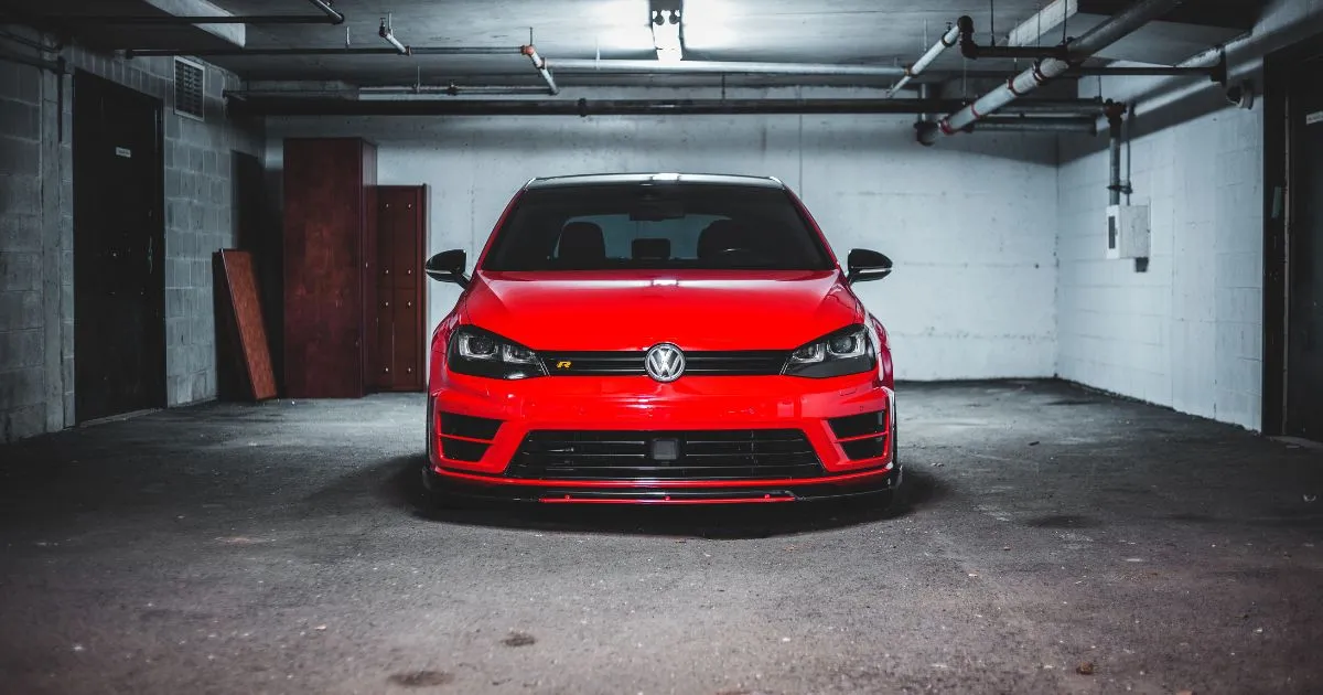 A Red Car Parked In A Rented Covered Parking Space