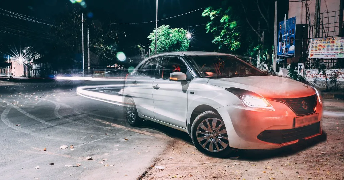 A Suzuki Swift Parked On The Roadside