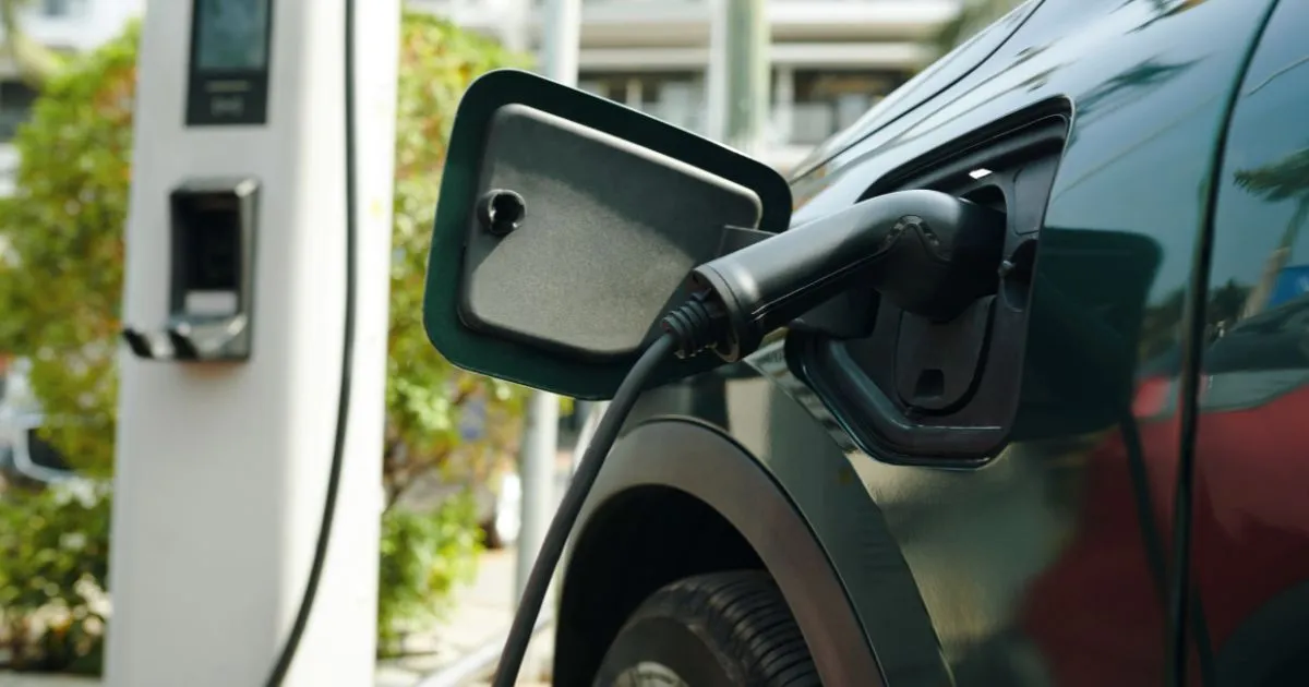 An Electric Vehicle Parked In A Car Park With Ev Charging Facilitiies