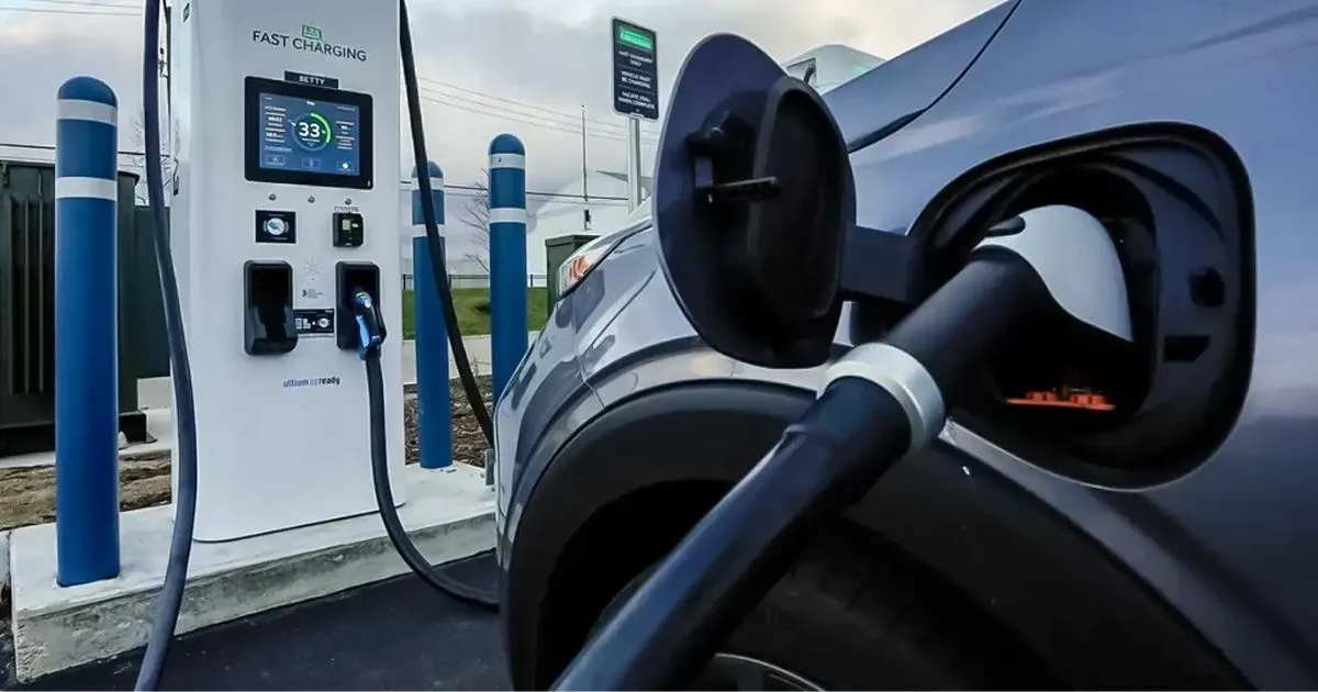 An Electric Vehicle Parked In An Ev Charging Station For Getting Charged
