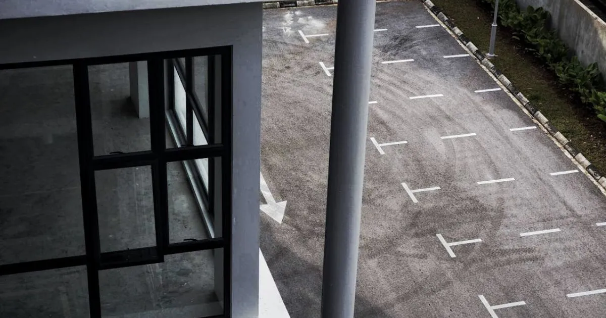 An Empty Parking Lot With Both Indoor And Outdoor Parking Spaces An Empty Parking Lot With Both Indoor And Outdoor Parking Spaces