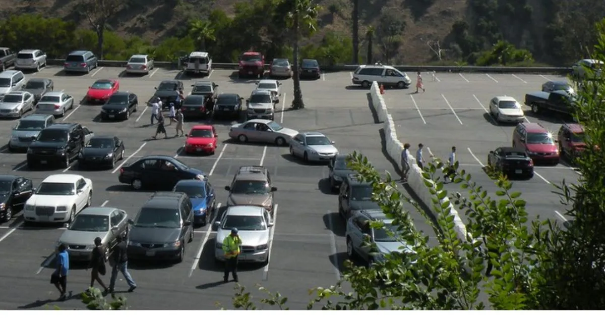 An Uncovered Parking Lot Of A Stadium With A Huge Capacity