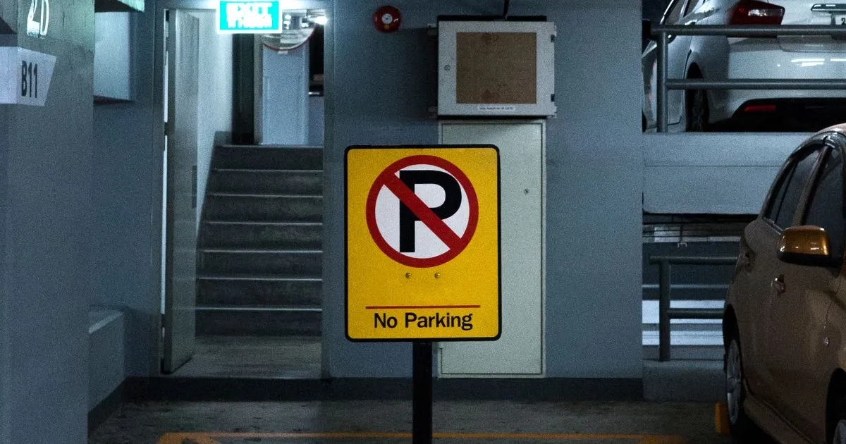 An Underground Parking Garage Uses Clear Signage For Parking Enforcement An Underground Parking Garage Uses Clear Signage For Parking Enforcement