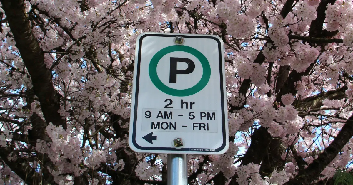 Car Parking Sign With Background Of Flowers Car Parking Sign With Background Of Flowers