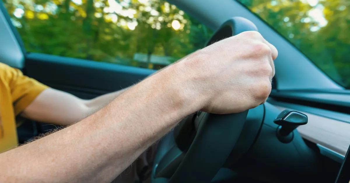 Close-Up of Hands On Steering Wheel Focused Driving Experience Close-Up of Hands On Steering Wheel Focused Driving Experience