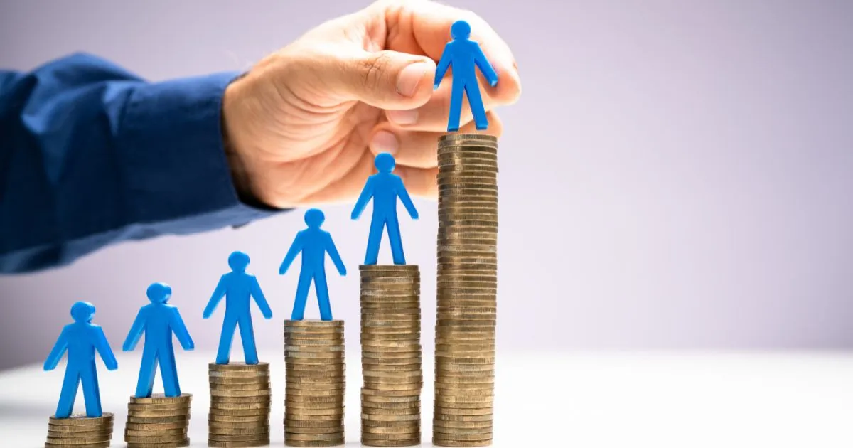 Coins Stacking Up In Increasing Numbers Showing Employee Growth 