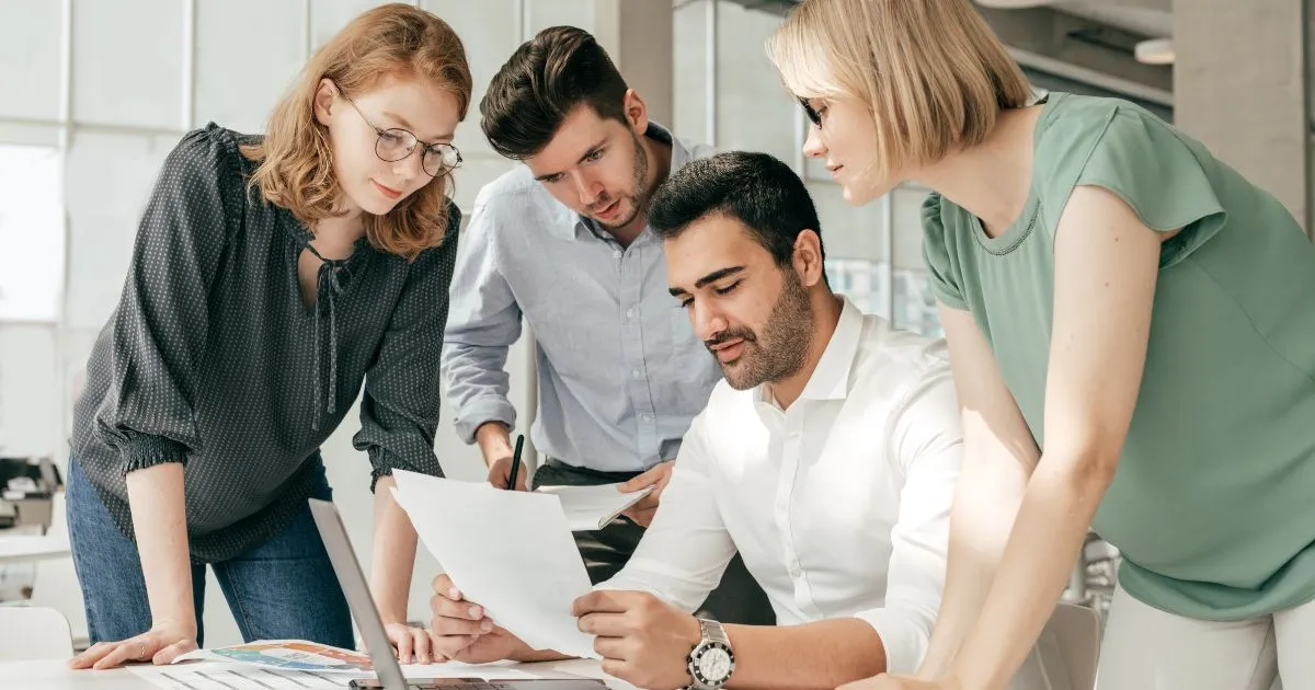 Company Officials Discussing Marketing Plan For Their Parking Rental Company